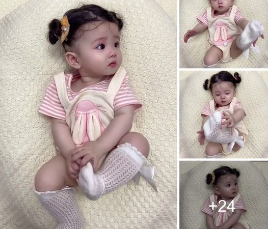 Infant’s Delightful Playful Interaction with Socks Expresses Joy